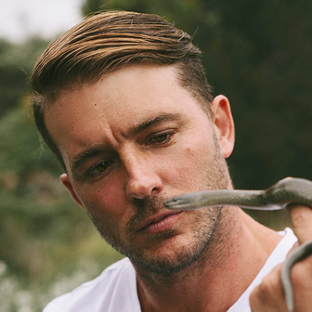 a Young, dynamic naturalist, conservationist, survival expert, and animal behaviour specialist